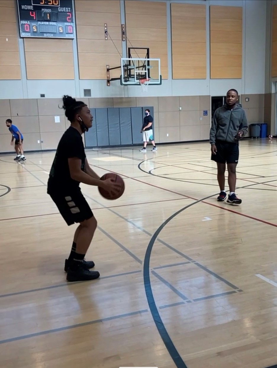 Photo of a kid playing about to shoot a basketball